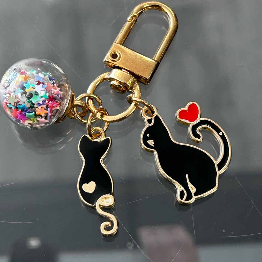 Charming Gold and Black Cat Keychain with Heart Accent